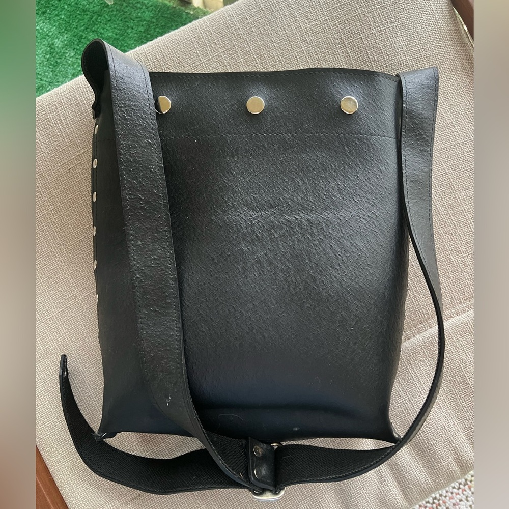 A rubber shoulder bag. It looks like it's made of rough leather.
